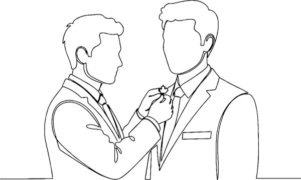 Man helping another adjust his necktie and suit formally.