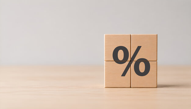 Percent sign on wooden cube blocks. Percentage, discount, sale, promotion, growth, margin,EBITDA, cost, budget, tax concept. Grey background and copy space. 