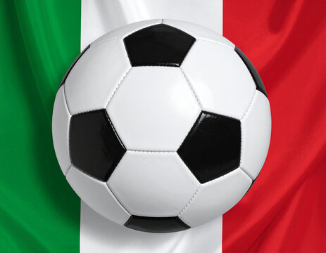 Bal&oacute;n de f&uacute;tbol sobre la bandera de EspaItalia&ntilde;a, imagen deportiva con colores nacionales, concepto de selecci&oacute;n espa&ntilde;ola, competici&oacute;n, mundial de futbol y deporte nacional