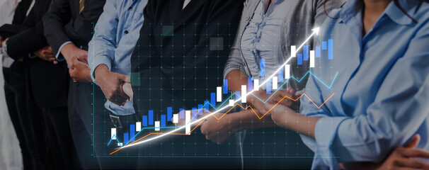 A group of diverse business professionals stands together, analyzing stock market trends. The rising graph and data visualization emphasize investment opportunities and growth potential. Axiom © InfiniteFlow