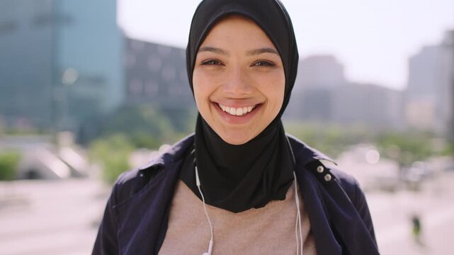 Smile, commute and face of muslim woman in city for university, education or studying with confidence. Hijab, portrait and islamic student in town for travel, morning and scholarship opportunity