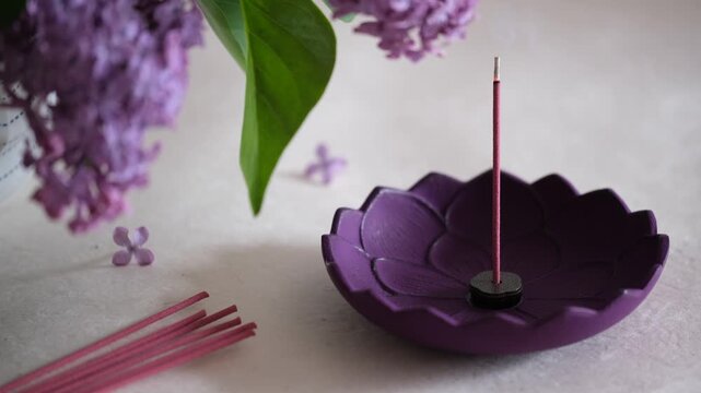Burning Japanese Incense Stick in Holder with Lilac Flowers, Zen Relaxation Scene