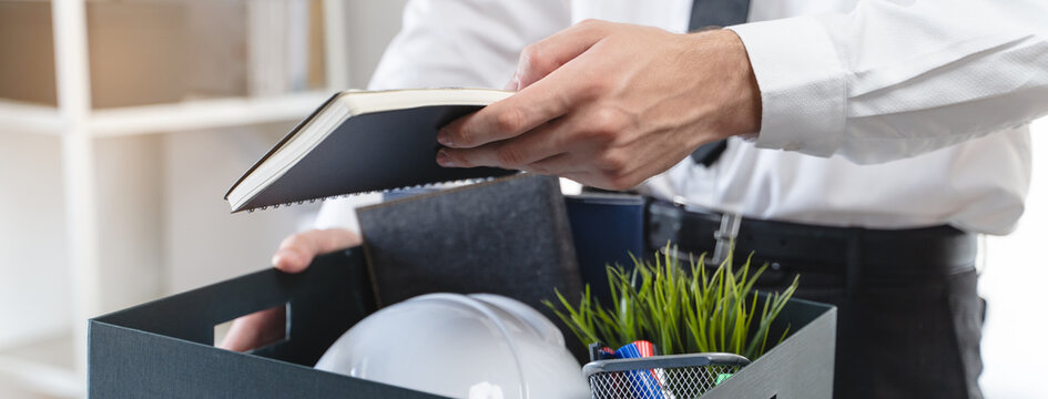lay off workers. Sad fired Businessman feeling stress after losing his job in the office.