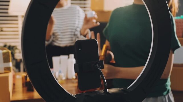 Diverse Beauty Bloggers Live Streaming Makeup Product Review on Social Media, Young Women Recording Video for Vlogging Channel with Ring Light, Friends Selling Cosmetic Products Online from Home
