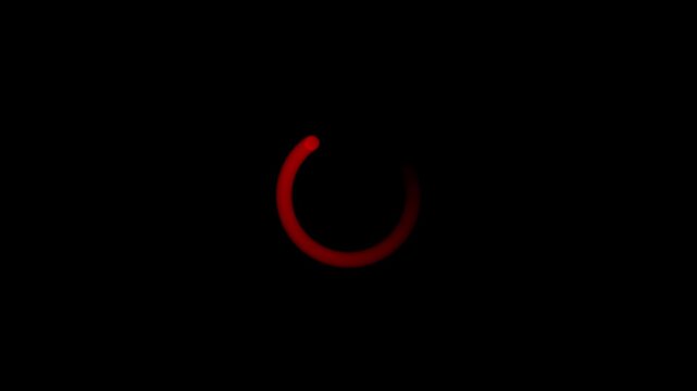 Glowing red circular loading progress indicator animation frame on a solid black background representing digital waiting or buffering status