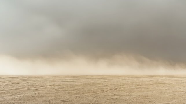 A dramatic dust storm engulfs a desert landscape with hazy skies and a palpable sense of atmospheric power.