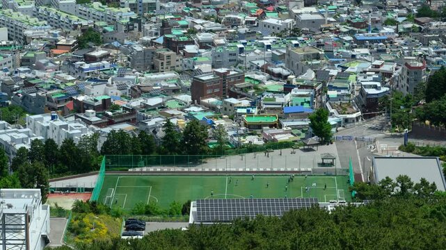 Aerial View of Football Field in Dense Urban Neighborhood Timelapse