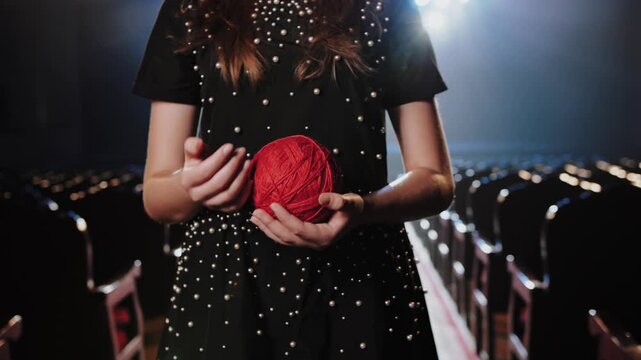 Woman in Holding Red Yarn Ball. Fashion Design Concept