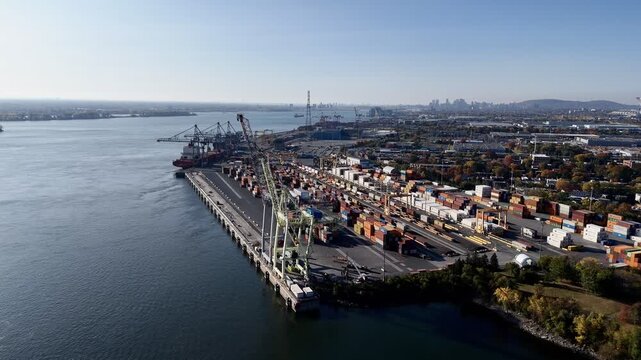 Aerial view of port industrial tanks and container yard near river in Montreal, Canada. g.