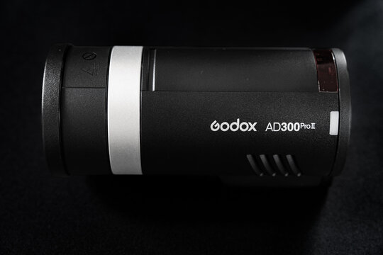 Godox AD300Pro II pocket flash studio strobe light on black background
