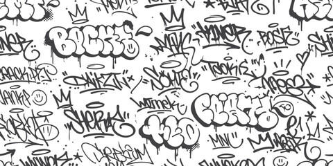Seamless pattern with black and white graffiti tags and street art elements © md