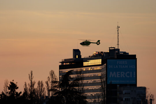 03-03-2026, Lyon, France. View on the medical helicopter Airbus Helicopters H135 T3 of the Samu taking off from Louis-Pradel Cardiovascular and Respiratory Hospital at sunset.