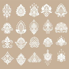 Ornate damask pattern collection including floral elements and corners for luxury decoration. © tubtim