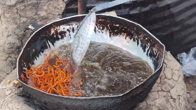 Street Food Frying In Hot Oil With Crispy Golden Texture And Sizzling Cooking Process