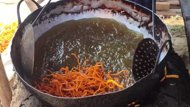 Street Food Frying In Hot Oil With Golden Crispy Texture And Sizzling Cooking Action