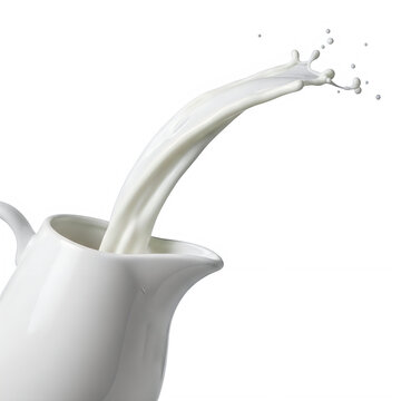 Milk being poured from a ceramic pitcher into a glass