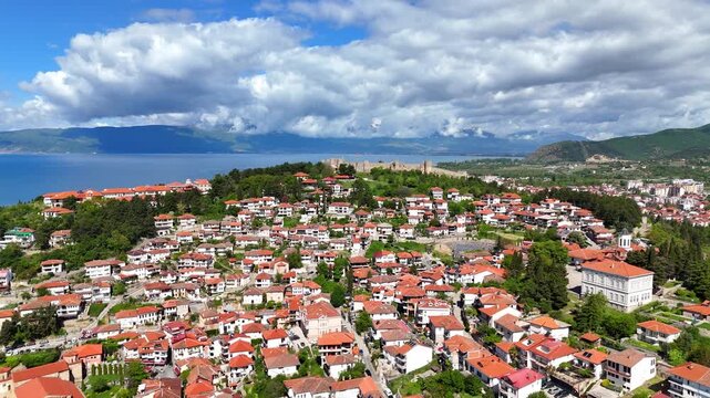 Aerial drone view of Tsar Samuel's Fortress on a hill in Ohrid, North Macedonia. Scenic panorama overlooking Lake Ohrid and the surrounding landscape.
