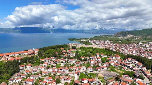 Aerial drone view of Tsar Samuel's Fortress on a hill in Ohrid, North Macedonia. Scenic panorama overlooking Lake Ohrid and the surrounding landscape.