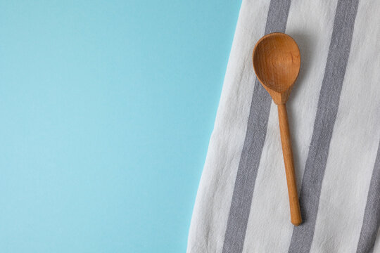 Kitchen towel on color background with copy space, minimalist kitchen concept