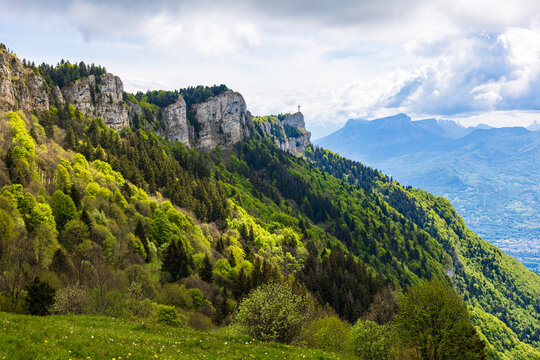 Panoramic view of the Croix du Nivolet overlooking the city of Chamb&eacute;ry from the top of its limestone cliff seen from the Alpage du Sire