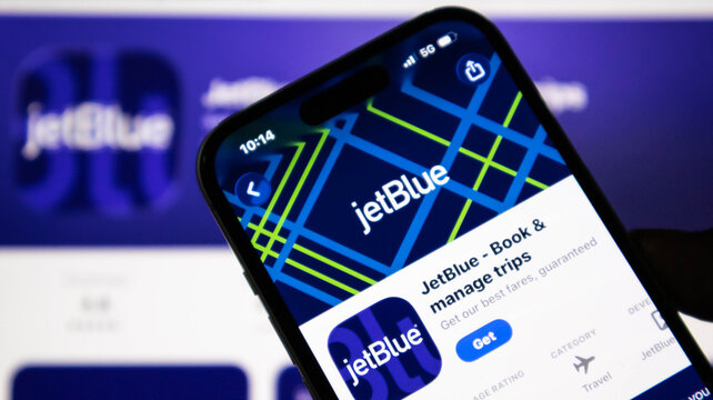 Closeup of a smartphone screen displaying the jetblue mobile application in an app store