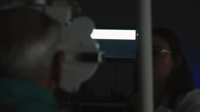 Medical professional conducting a vision test on a patient