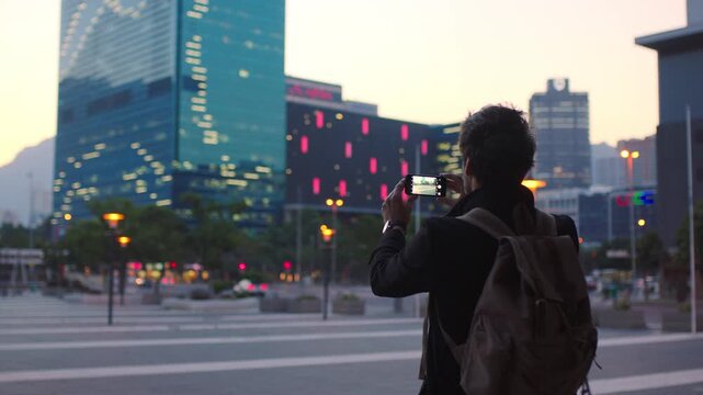 Photography, night and man with phone in city, international student or study opportunity for post. Education, mobile or person with evening picture for abroad travel blog, exchange programme or back