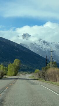 Driving through Grand Teton National Park, approaching Teton Village on Moose Wilson Road