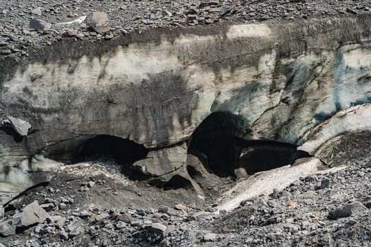 Melting ice cave in Mer de Glace glacier illustrating climate change