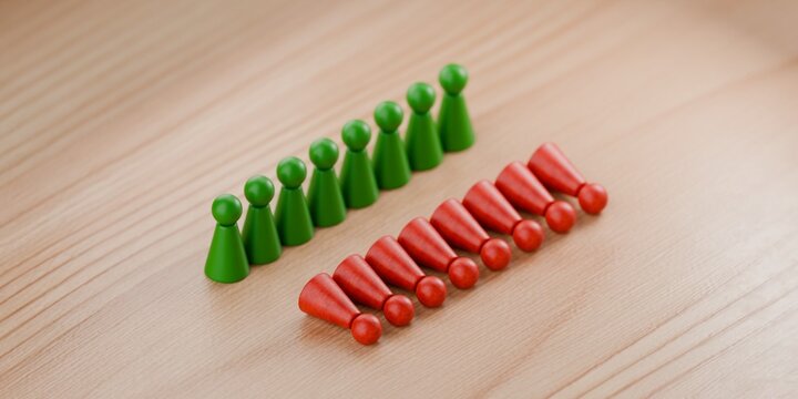 3d pawn figurines in green standing tall, with red pawns knocked over, societal issues, disagreement, winners and losers