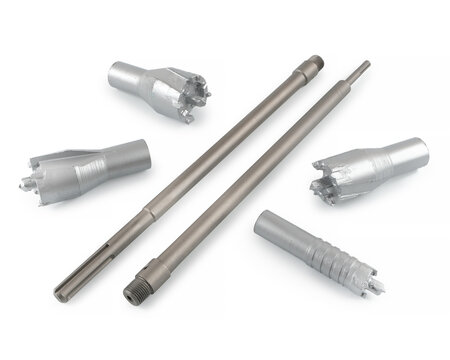High-quality studio product shot of various metalworking tools, including diamond grit burrs and carbide end mills. Industrial cutting equipment on a white reflective backdrop.