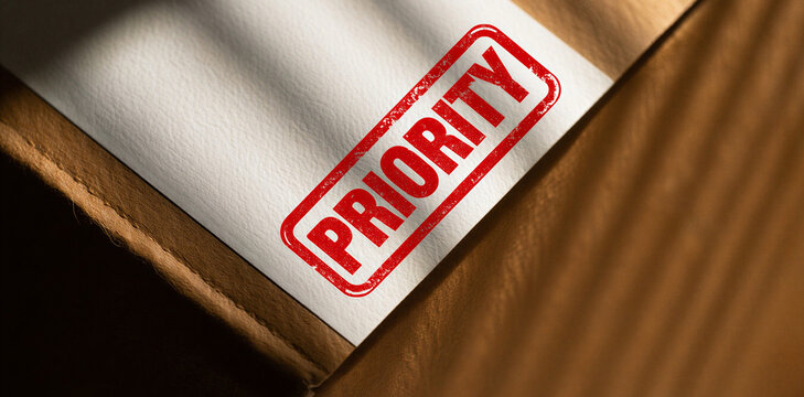 Red ink stamp with priority text on shipping package priority shipping logistics delivery important distribution handling processing business commerce transport tracking document