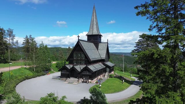 Wooden church in Oslo, Norway.  Aerial drone view of Holmenkollen chapel, a tourist destination registered in Norway's cultural heritage database.