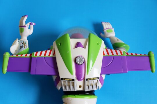 Salvador, Brazil - June 6, 2026: Buzz Lightyear toy on a blue background. Toy Story Buzz. Laser, Jet Exhaust close-up. 