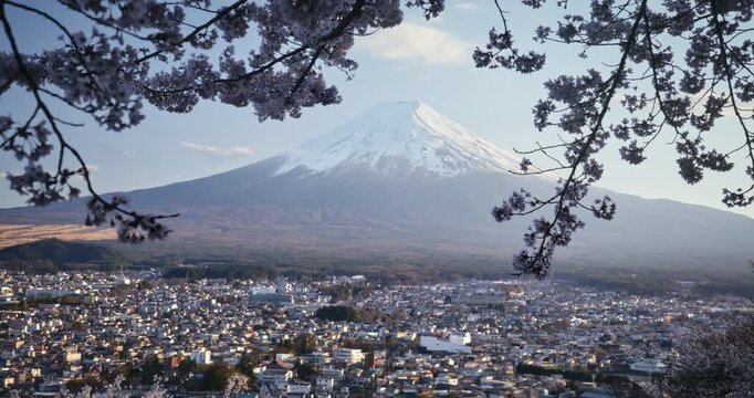 Beautiful wide view of Japanese city with hazy, legendary Mt. fuji in distance