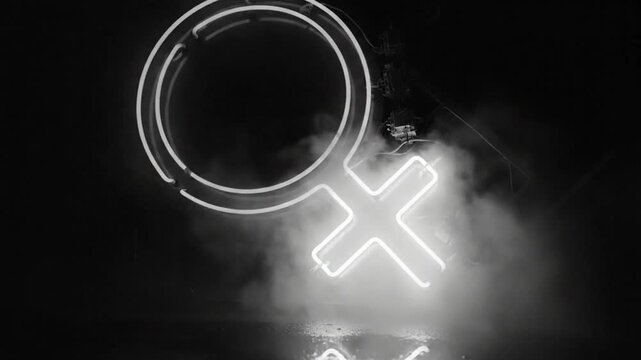 Neon illuminated venus symbol in fog, black and white artistic representation, gender identity concept