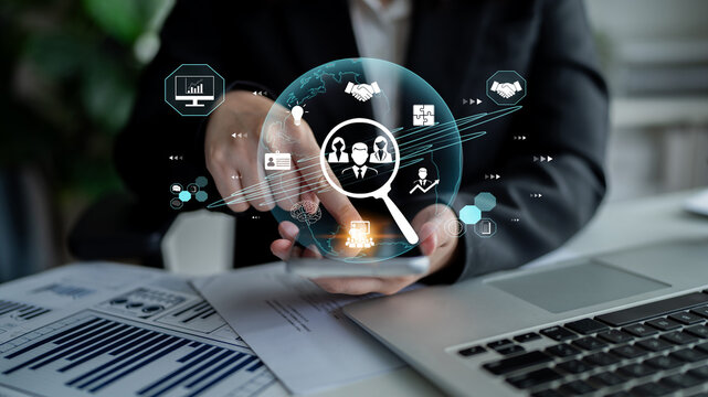 Businessman Using Digital Technology for Data Analysis and Strategy Development in Modern Office Environment Fluxor.