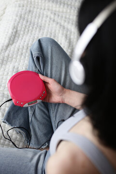Portable CD player with headphones in Y2K retro vibe
