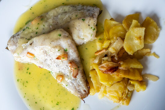 Sea Bream in Garlic and Olive Oil sauce with Panadera style Potatoes.