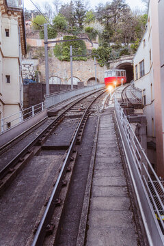 Urban funicular railway tracks and red car in Lyon, France