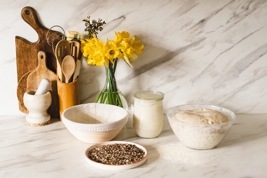 Homemade sourdough preparation in a cozy kitchen