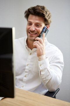 Business professional on phone in modern office