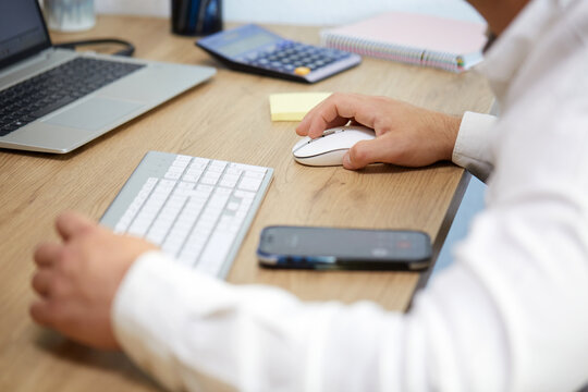 Professional working at a desk with tech gadgets
