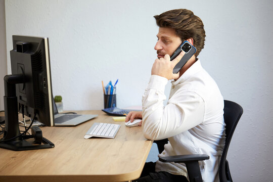 Professional man focused on office work with technology