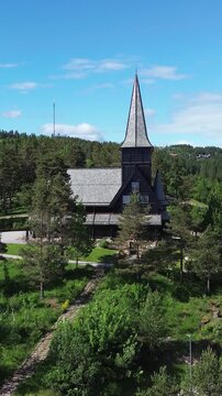 Wooden church in Oslo, Norway.  Aerial drone view of Holmenkollen chapel, a tourist destination registered in Norway's cultural heritage database.