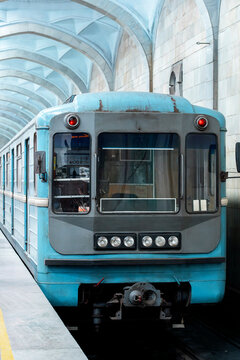 Vintage metro train at Tashkent station with arches