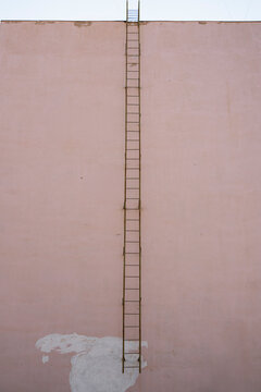 Minimal facade with vertical ladder in Uzbekistan cityscape