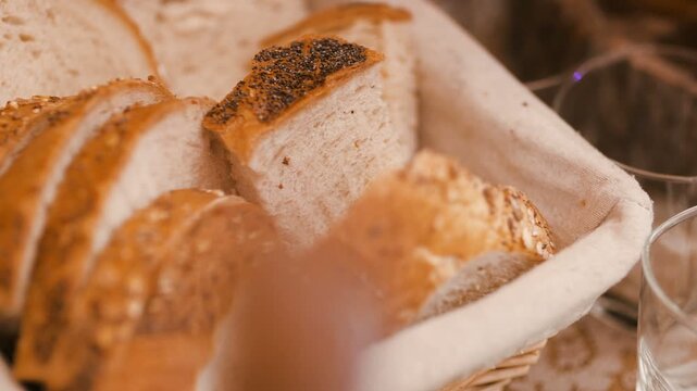Sliced bread loaves arranged in a warm bakery display