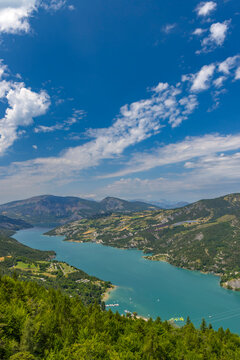 Lac de Serre Poncon water activities and mountain landscape in Crots