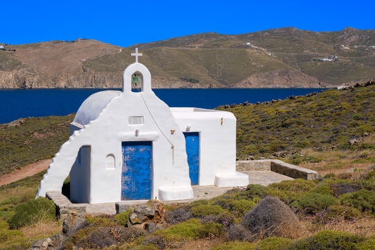 White chapel with blue door, Mykonos, Greece